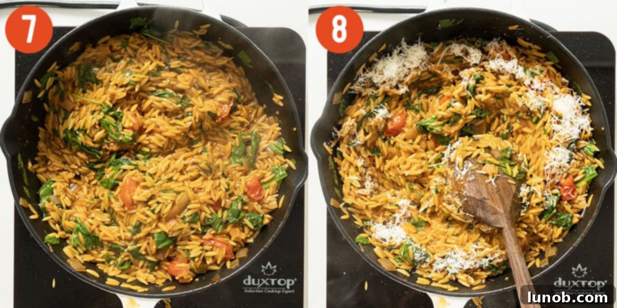 Fresh spinach and grated parmesan being stirred into the cooked orzo, creating a creamy and vibrant dish.