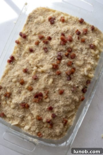 Italian Comfort Mac and Cheese 8 Baked mac and cheese in a baking dish topped with breadcrumbs and crispy pancetta