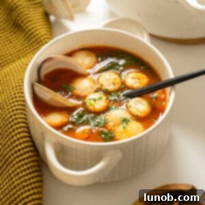 Manhattan clam chowder topped with oyster crackers.