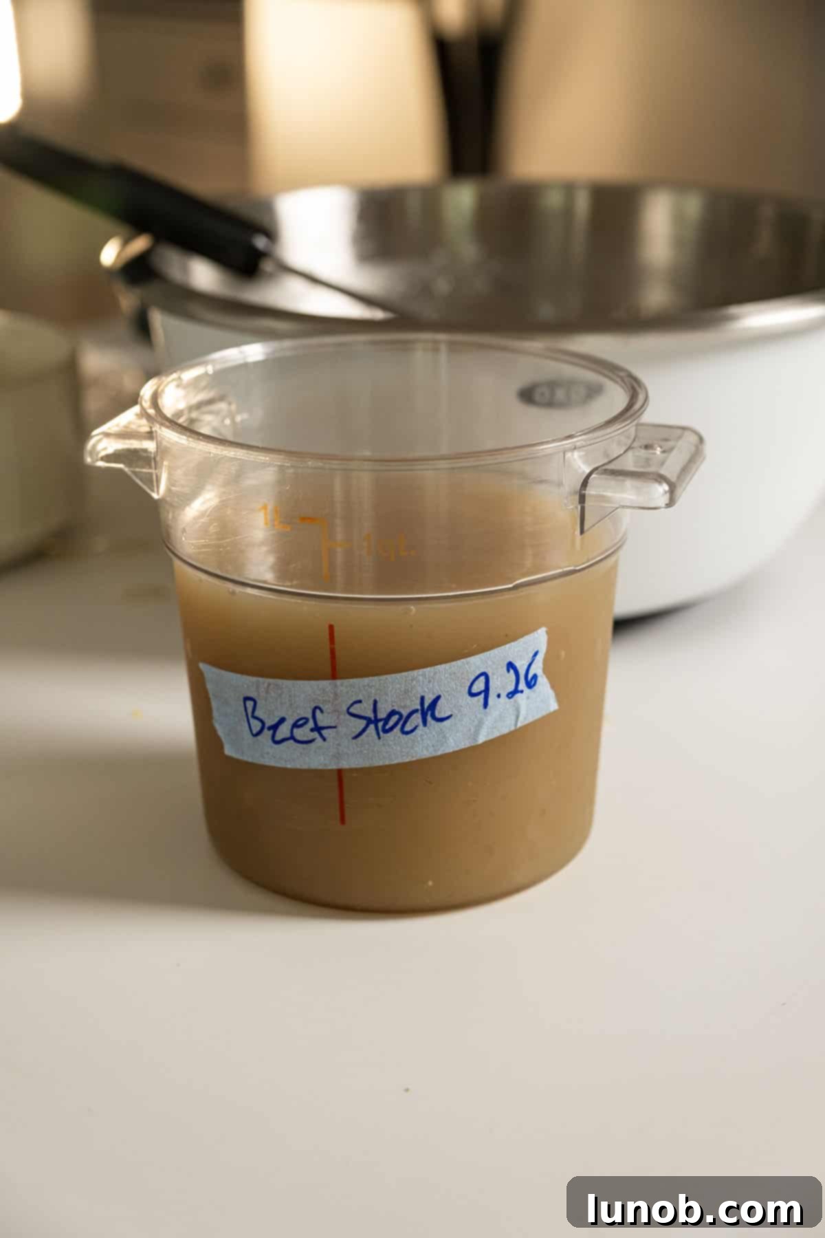 Beef stock in a container.