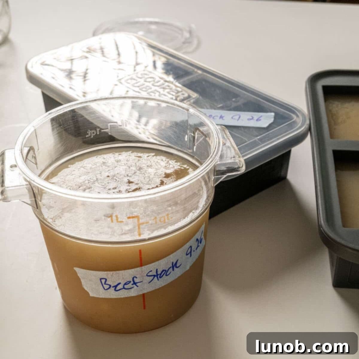 Beef stock in a container.