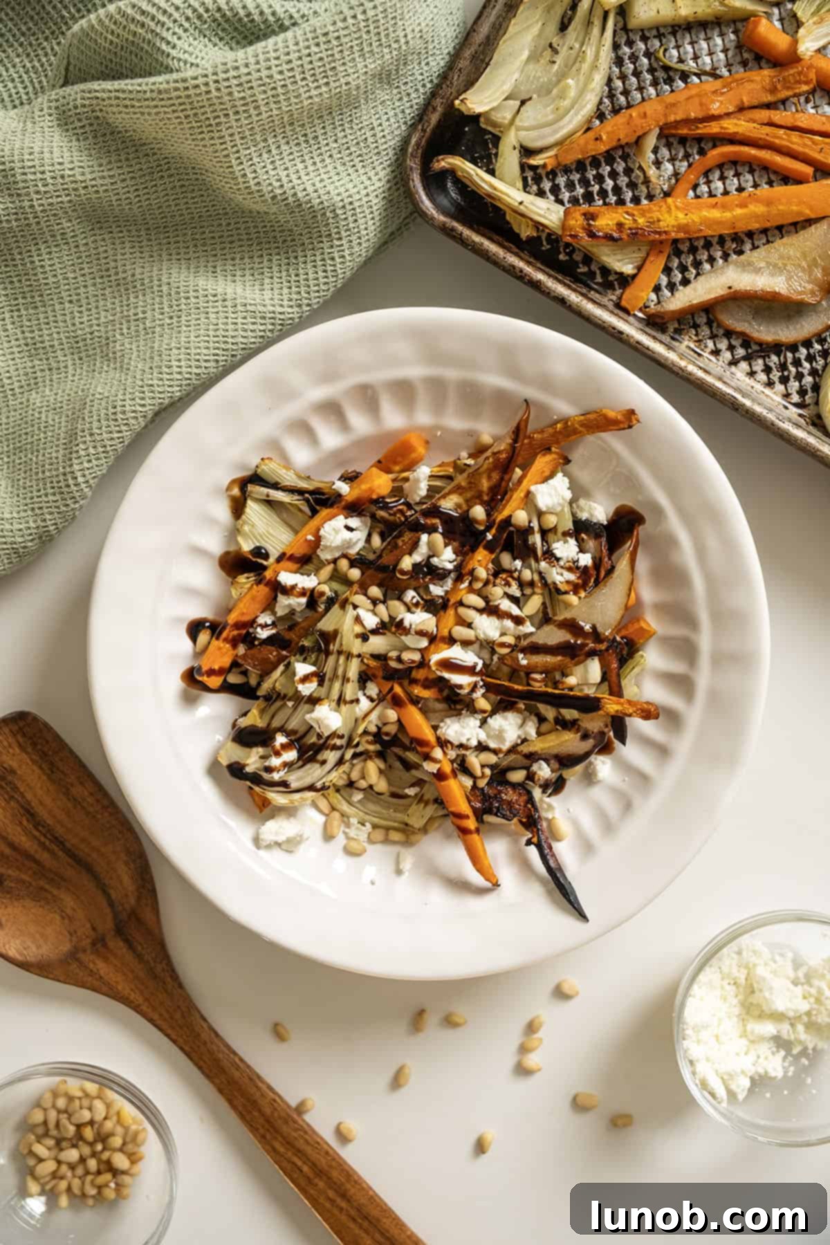 Sweet and Earthy Roasted Carrots and Fennel 2 Roasted Carrots and fennel topped with pine nuts and balsamic glaze.