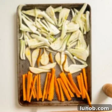Sweet and Earthy Roasted Carrots and Fennel 5 Fennel, carrots, and pears on a baking pan.