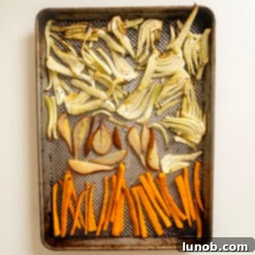 Sweet and Earthy Roasted Carrots and Fennel 6 Roasted fennel, carrots, and pears on a baking pan.