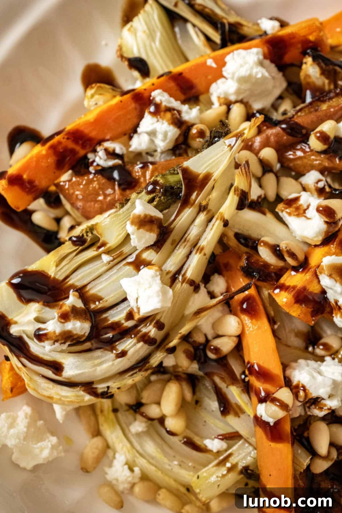 Sweet and Earthy Roasted Carrots and Fennel 9 Roasted Carrots and fennel topped with pine nuts and balsamic glaze.