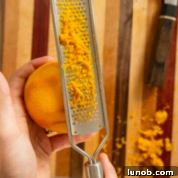 Zesting an orange for the vinaigrette dressing.