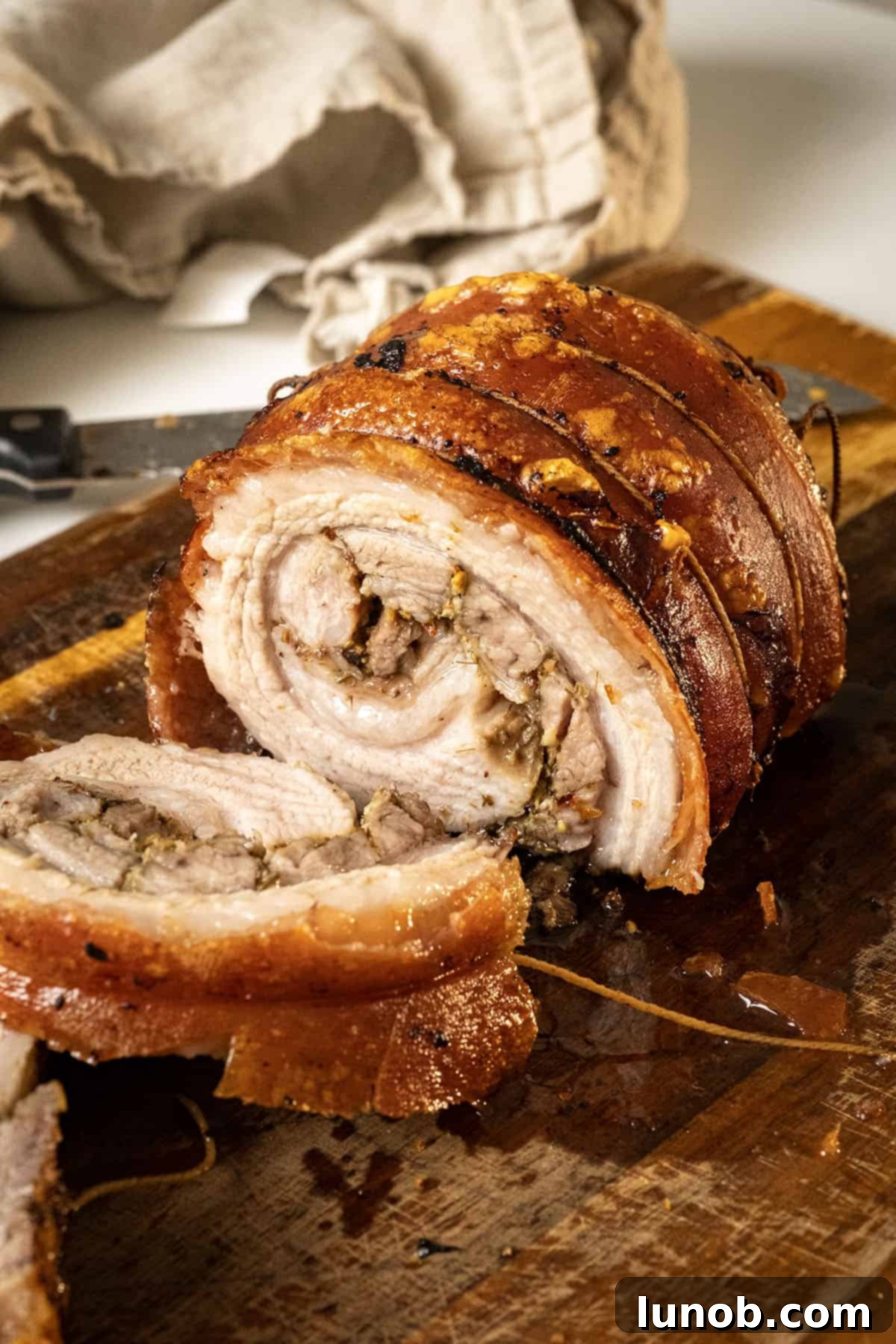 Italian Porchetta Perfection 2 Authentic Italian Porchetta on a cutting board.