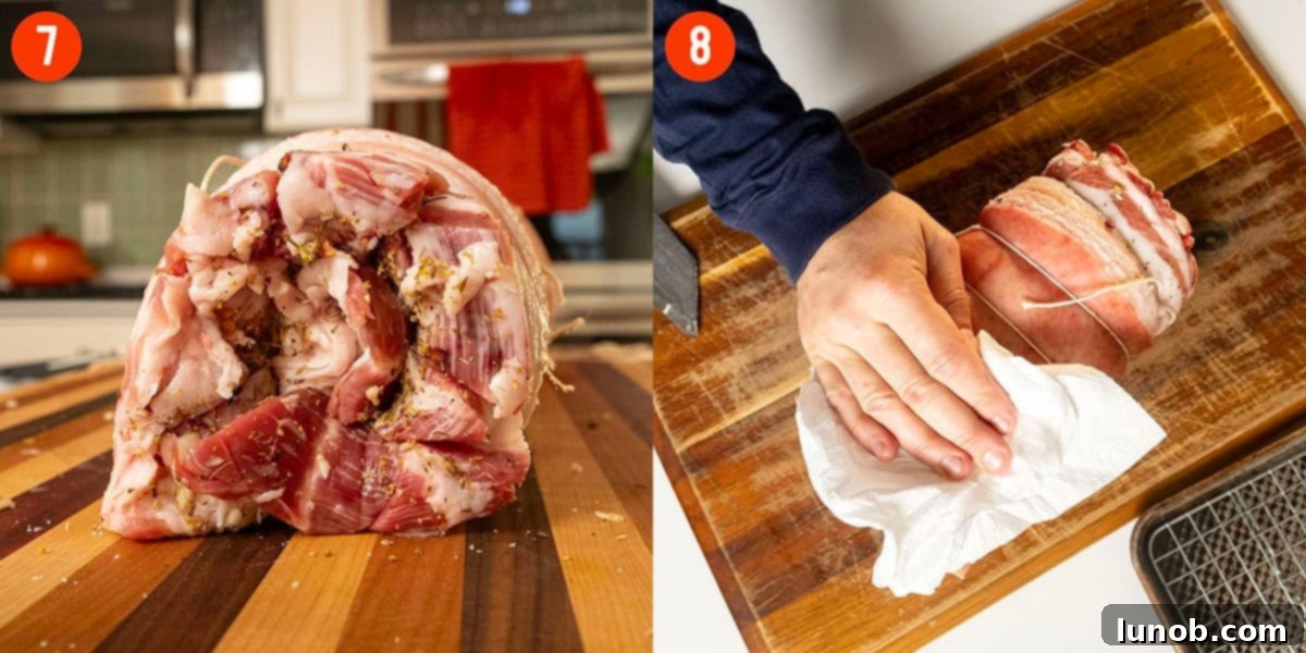Italian Porchetta Perfection 10 Patting pork belly dry.