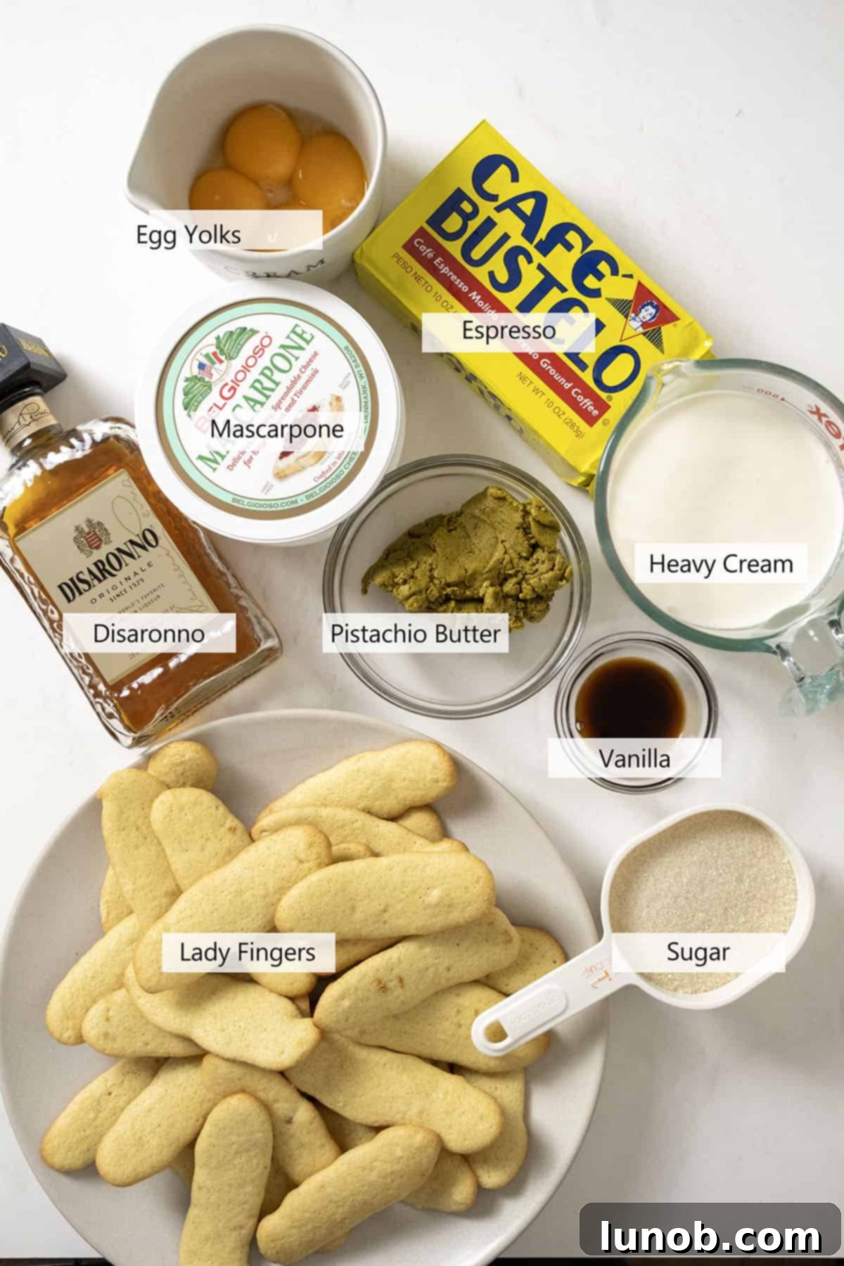 Ingredients for the recipe, including pistachios, mascarpone, eggs, and espresso.