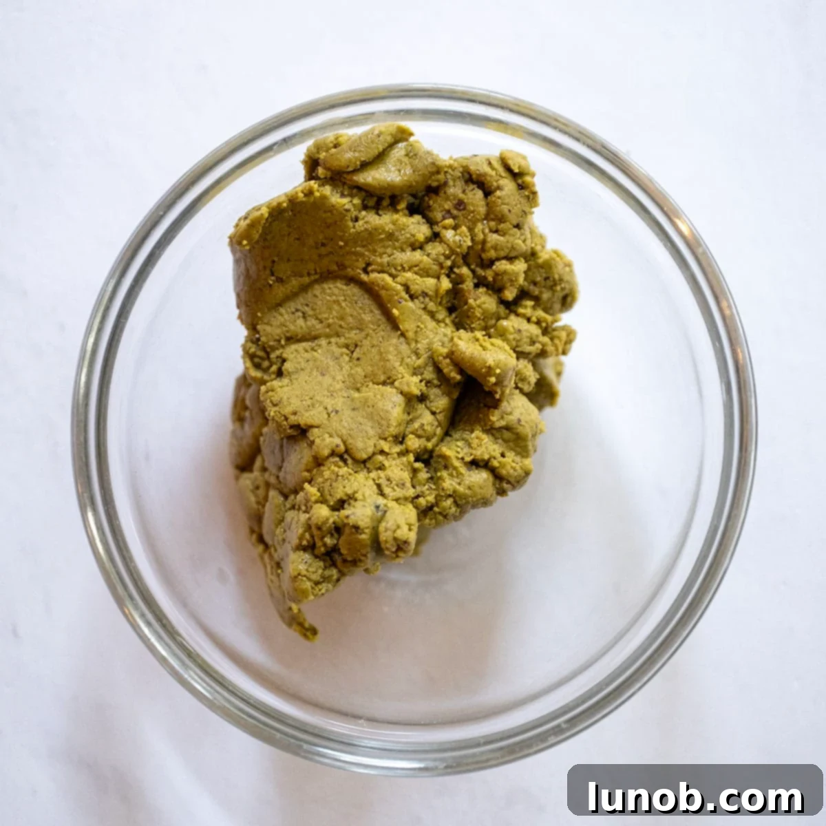A bowl of vibrant green homemade pistachio butter.