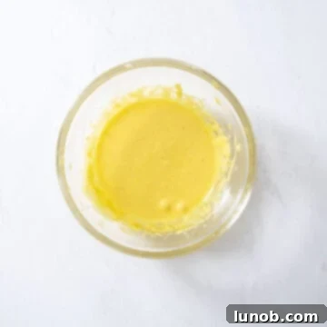 Egg yolks and sugar combined in a bowl, beaten until light and airy.