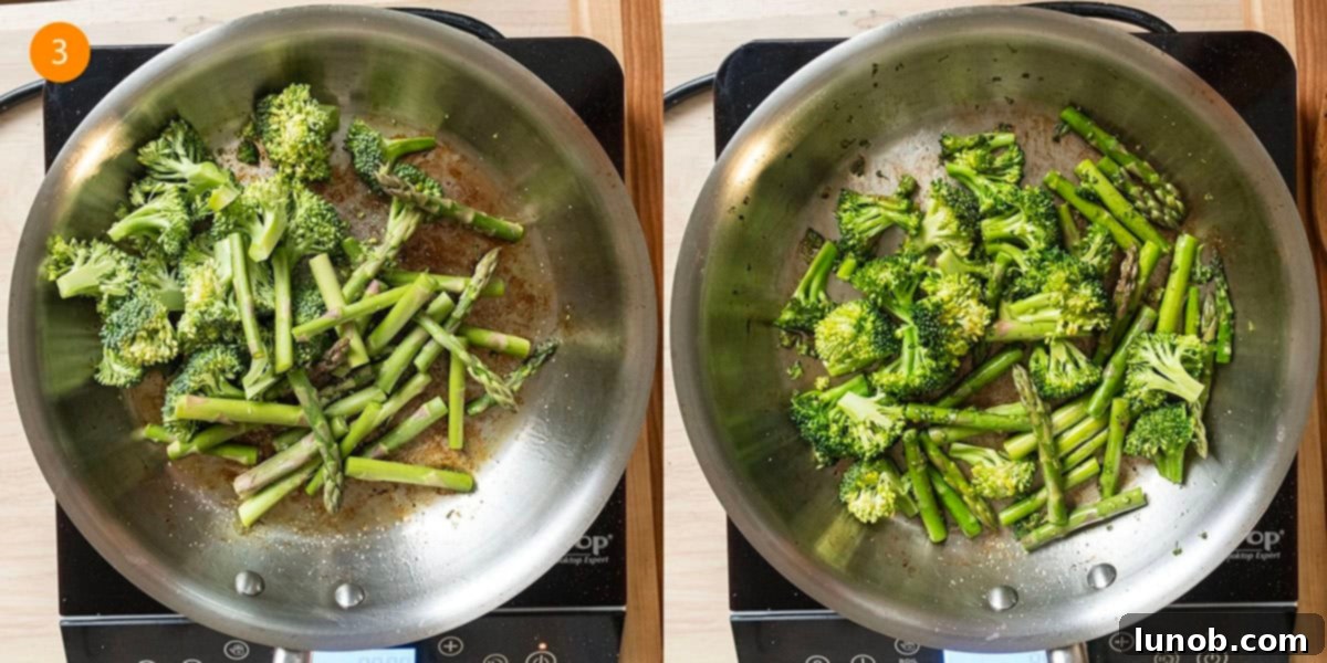 Sauteing bright green broccoli and asparagus in a saucepan.