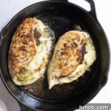 Irresistible Pesto Stuffed Chicken 9 Cooked pesto stuffed chicken breast, fresh out of the oven and perfectly golden.
