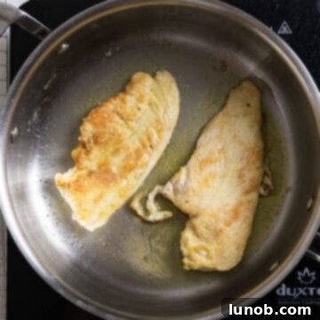 Gourmet Chicken Marsala 6 Frying chicken breasts in the pan in olive oil.