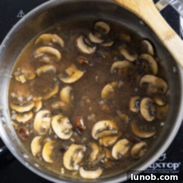 Gourmet Chicken Marsala 8 Marsala wine and chicken broth added to the pan with mushrooms and shallots.
