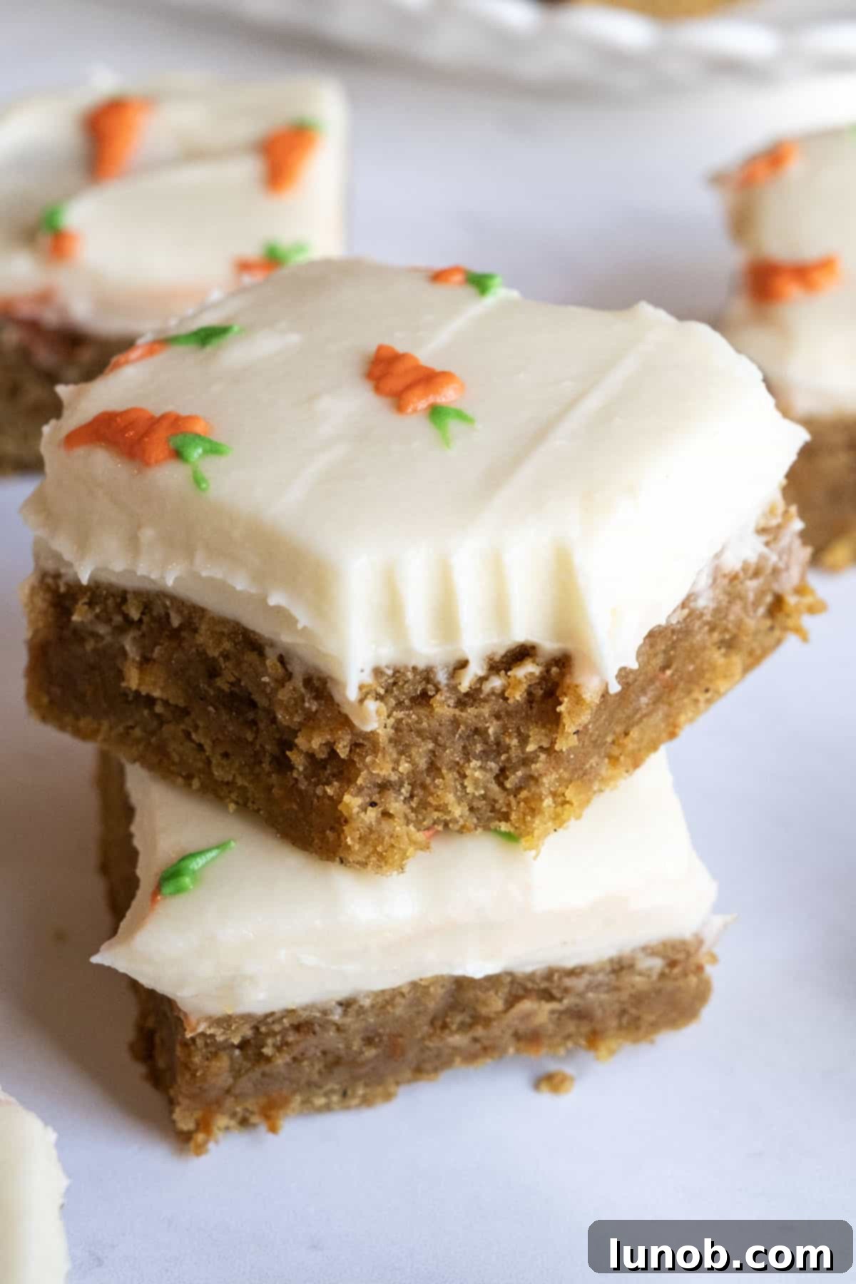 finished carrot cake blondies with cream cheese frosting, ready to serve