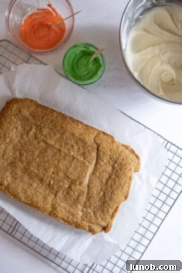 blondies cooling with cream cheese frosting on the side