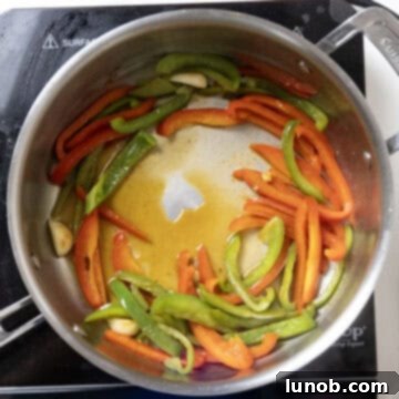 Ultimate Chicken Pizzaiola 8 Deglazing the pan with vodka, scraping up flavorful browned bits to enrich the sauce.