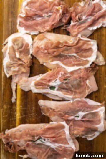 chicken breast topped with sage and prosciutto