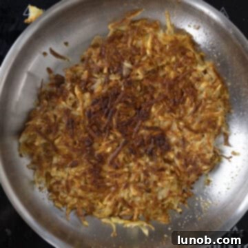 Frying hashbrowns.