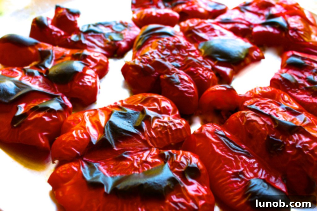 Perfectly Roasted Red Peppers: Freeze for Future Flavor 3 A selection of vibrant red peppers, some whole, some halved and roasted, showcasing the roasting process and delicious end result.