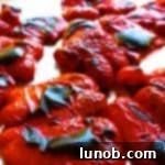 Two halves of roasted red peppers in a freezer bag, illustrating how to freeze them