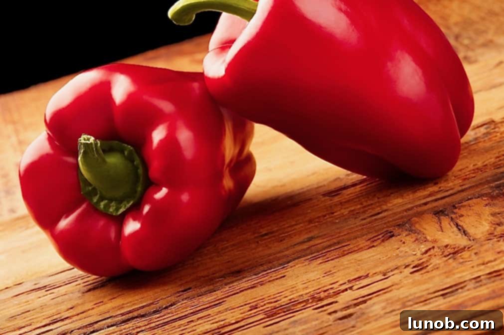 Perfectly Roasted Red Peppers: Freeze for Future Flavor 6 A bowl of vibrant roasted red peppers, some whole, some sliced, ready to be incorporated into dishes