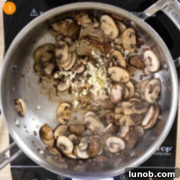 Velvety Garlic Mushroom Pasta 6 Sauteed mushrooms with garlic added in pan.