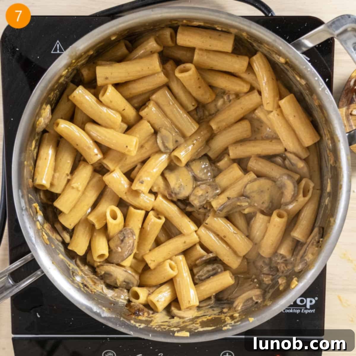 Velvety Garlic Mushroom Pasta 10 Sauce thickened with pasta.