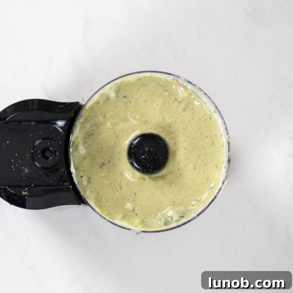 Fresh Avocado Lime Crema 9 crema processed in the food processor.