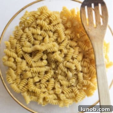 pasta combined with olive oil in a bowl.
