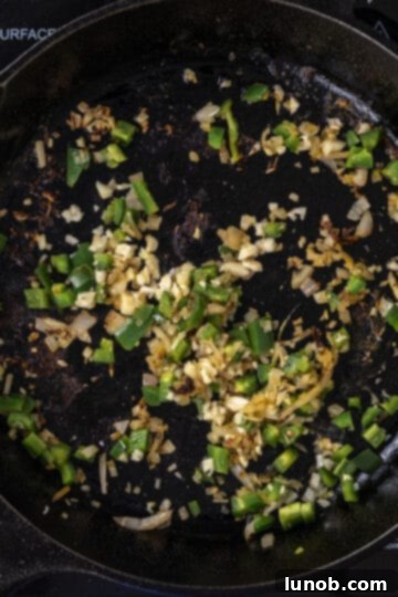 sauteed shallots, garlic, and jalapenos in the cast iron pan