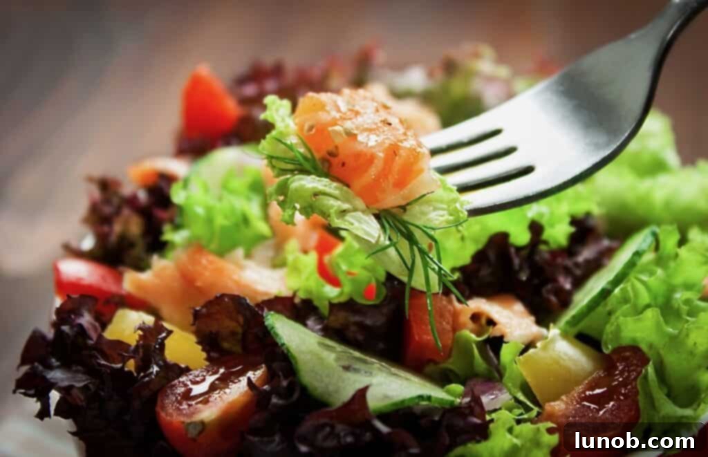 Craft the Ultimate Grilled Salmon Salad: 7 Secrets to Success 3 A vibrant, fresh salad on a rustic wooden board, emphasizing healthy eating and fresh ingredients