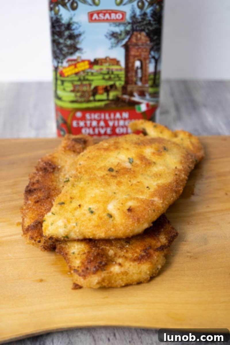 Golden Cutlets The Right Oil for Frying 12 A chicken cutlet fried in extra virgin olive oil, highlighting its texture and color.