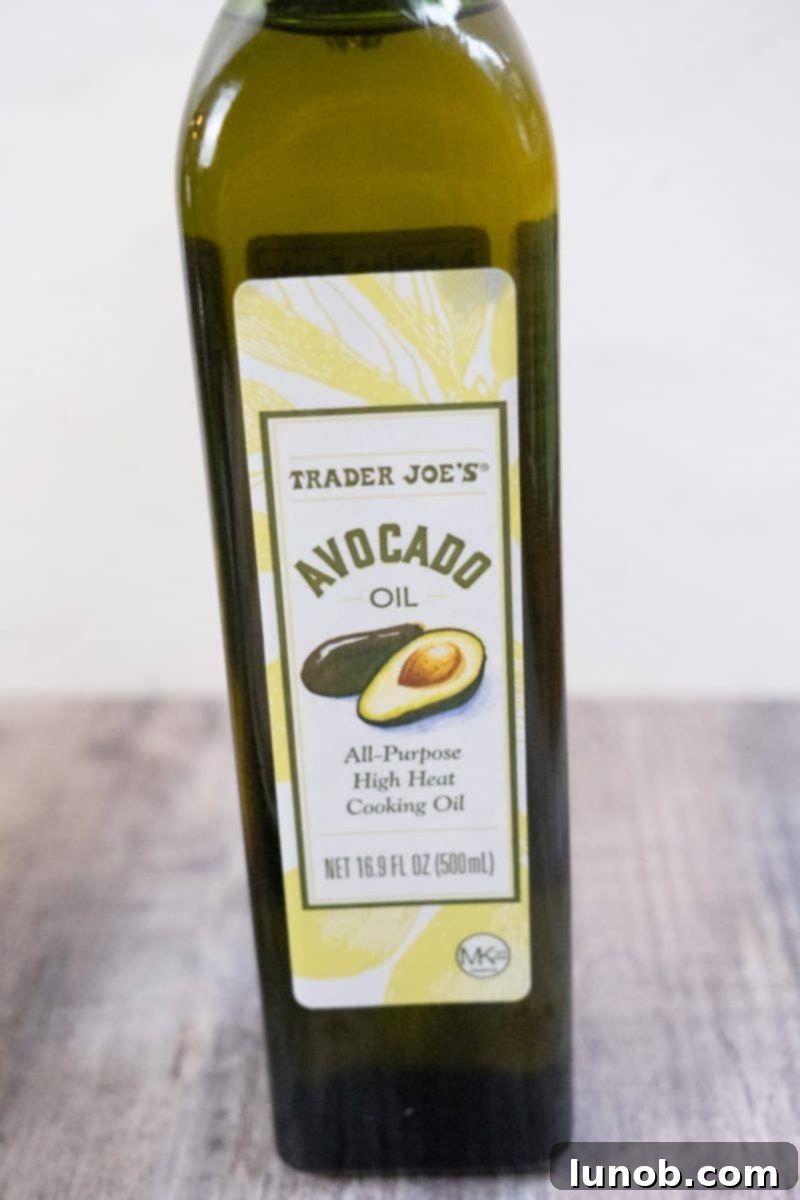 Golden Cutlets The Right Oil for Frying 3 A bottle of avocado oil on a clean kitchen surface.