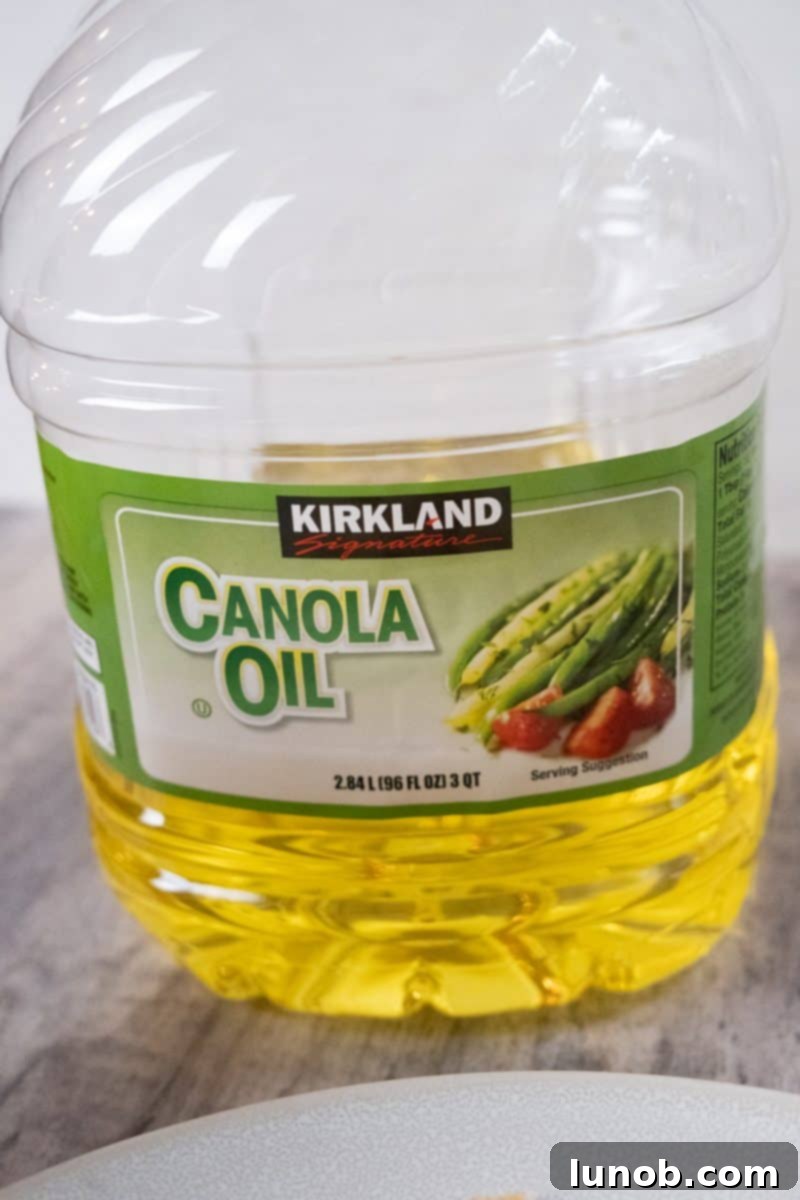 Golden Cutlets The Right Oil for Frying 4 A bottle of canola oil prominently displayed.