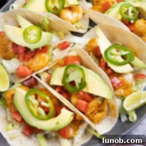 Delicious Volcano Shrimp Tacos, garnished with fresh cilantro and a drizzle of lime, ready to be served.