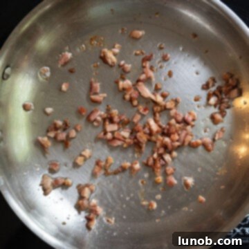 Classic Pepper & Egg Sub 5 pancetta frying in a frying pan.