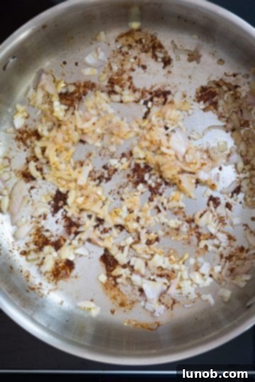 Fiery Fra Diavolo Shrimp Linguine 6 Sautéing finely chopped shallots and minced garlic in a saucepan, forming the aromatic base of the sauce.