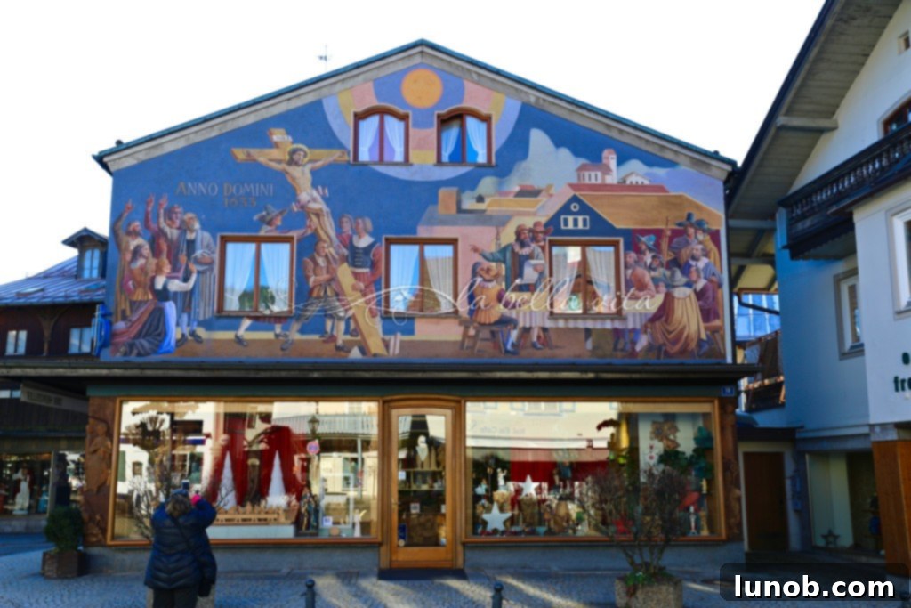 Oberammergau, Bavaria, Germany Home of the Passion Play. Favorite mural depicting the crucifixion, above a woodcarving shop, with stunning blue colors.