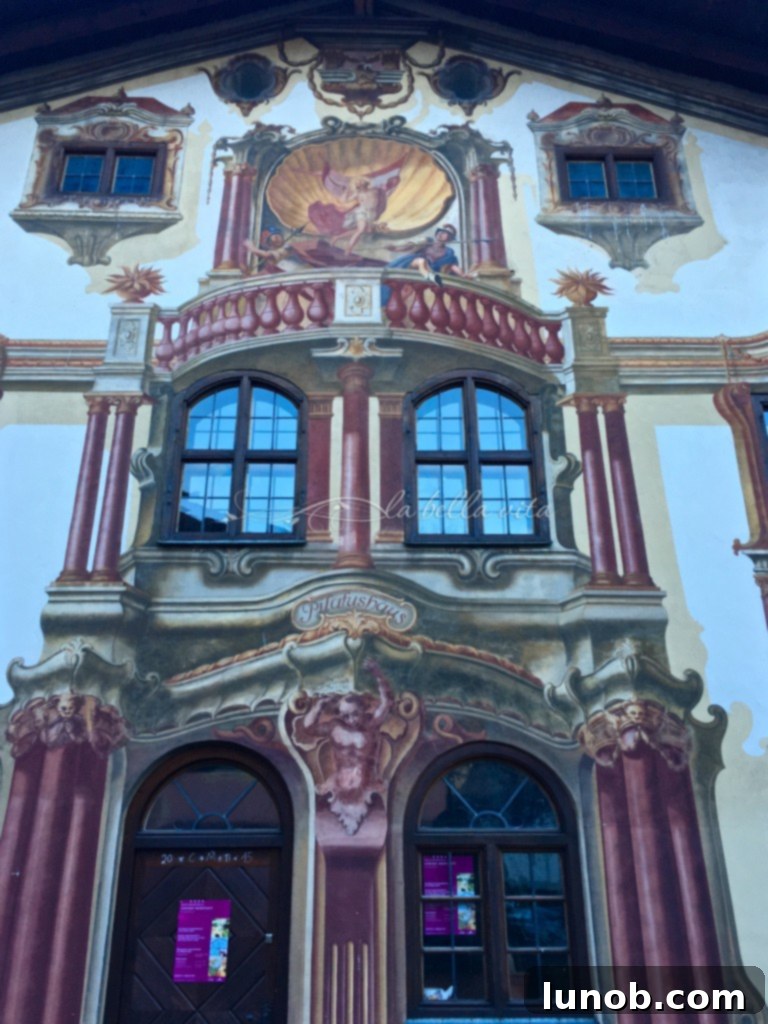 Oberammergau, Bavaria, Germany. Beautiful trompe l'oeil mural creating the illusion of actual architecture on a building facade.