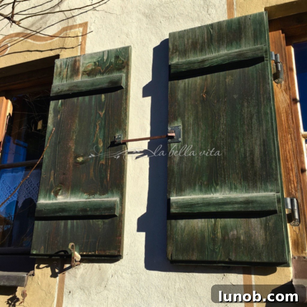 Oberammergau, Bavaria, Germany. Simple, old, rustic wooden shutters with beautiful texture on a traditional Bavarian house.