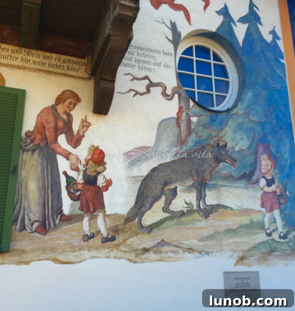 Oberammergau, Bavaria, Germany. Detailed look at the 'Little Red Riding Hood' wall mural on this charming home.