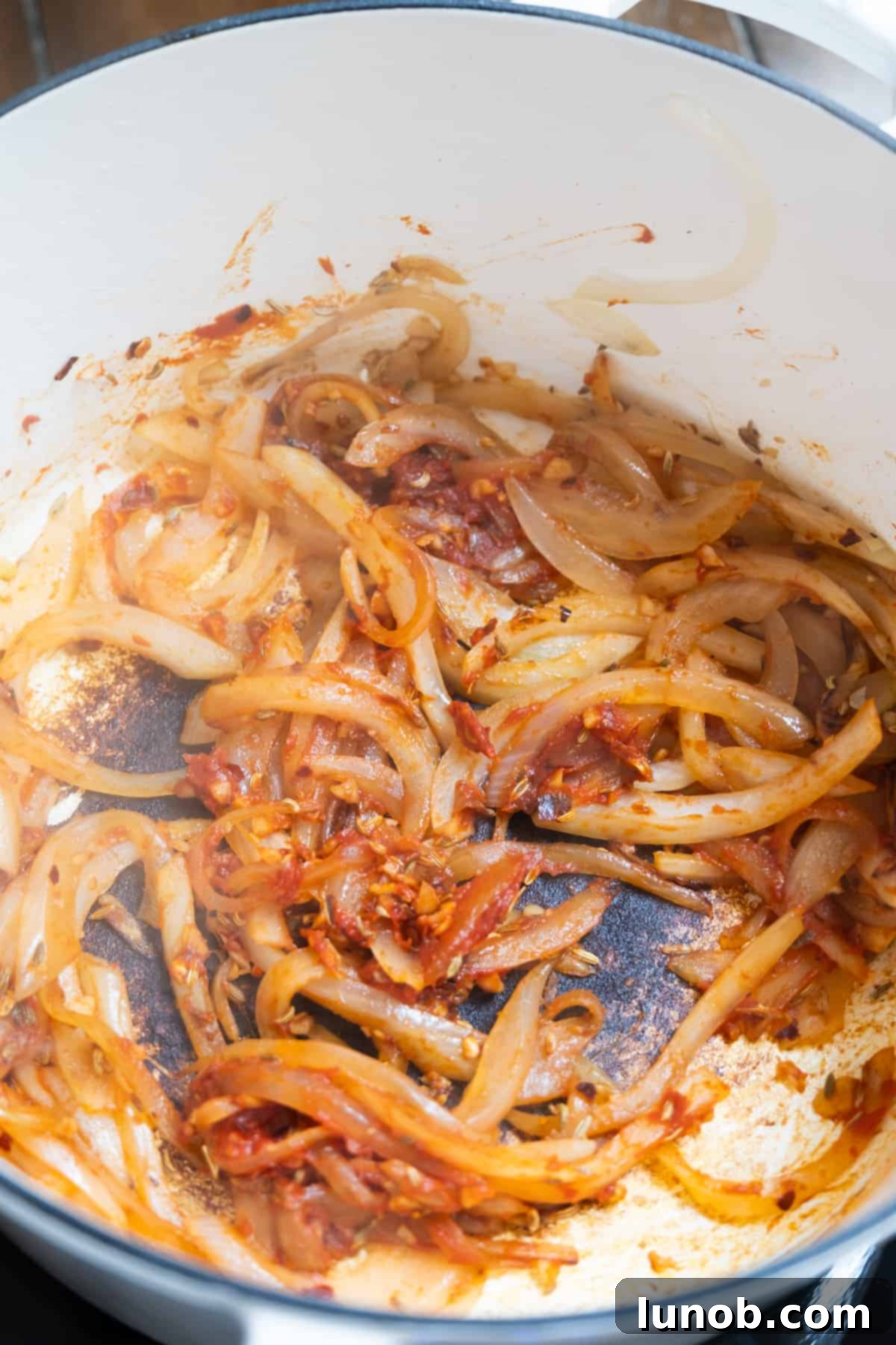 Onions and caramelized tomato paste mixed together, forming a rich base for the Italian cabbage