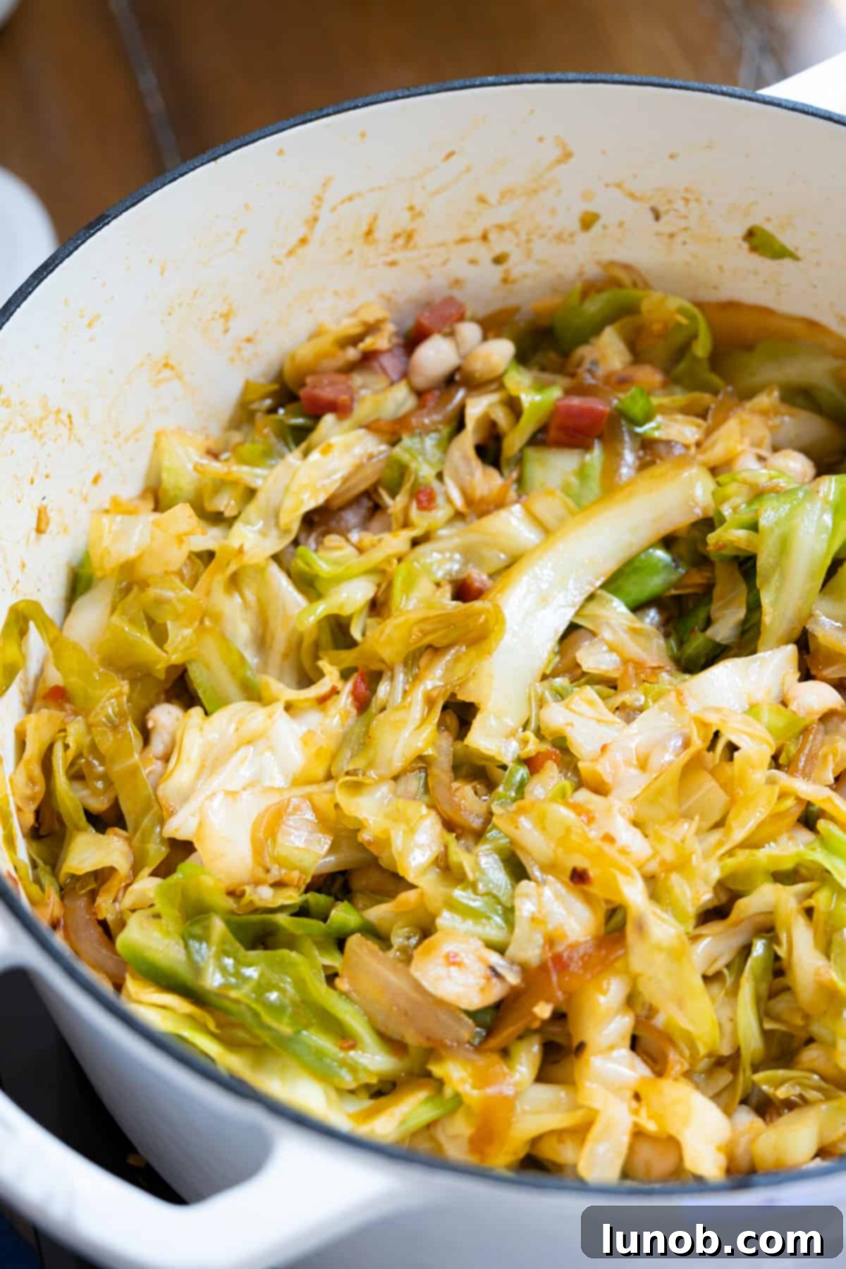 Tender Italian cabbage with pancetta, fully cooked and ready to mix with beans
