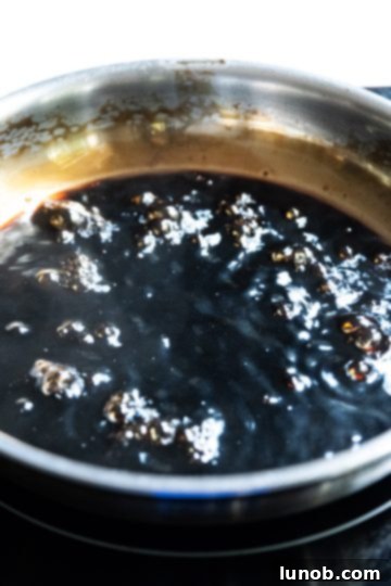 Gourmet Italian Stuffed Portobello Bake 9 balsamic glaze simmering