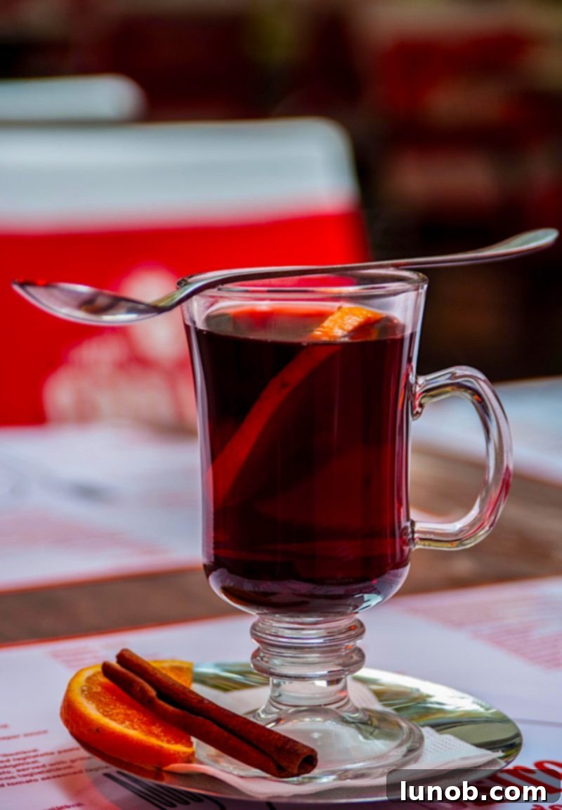 Gluhwein German Mulled Wine Munich Nuremberg Tradition 2 Traditional German Glühwein served in a festive mug at a Christmas market