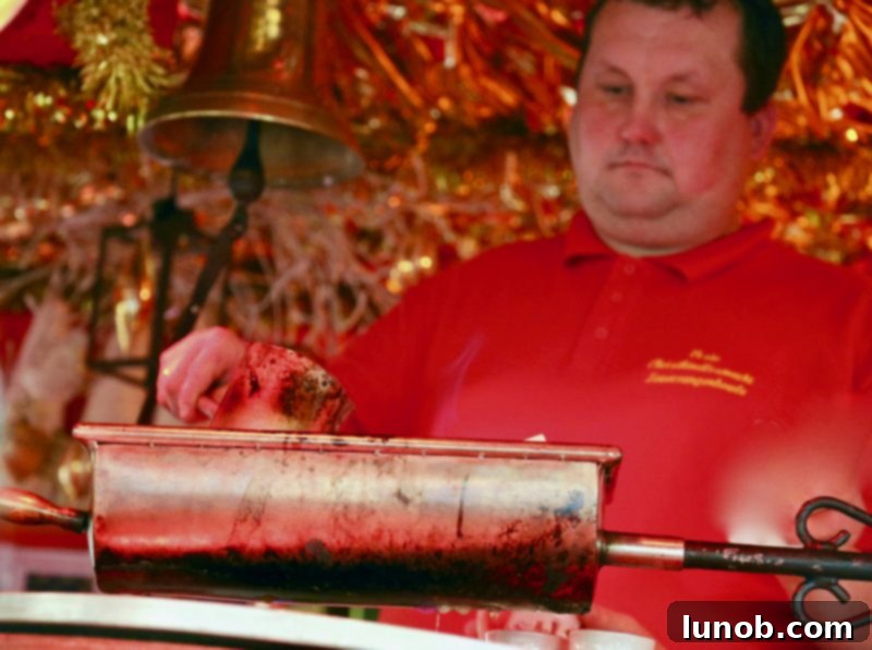 Gluhwein German Mulled Wine Munich Nuremberg Tradition 11 Vendor scooping hot Glühwein from a copper cauldron at a Christmas market