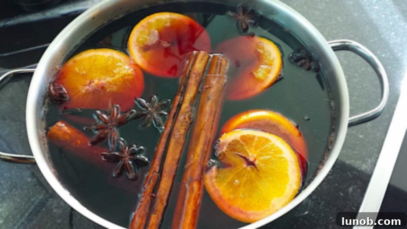 Gluhwein German Mulled Wine Munich Nuremberg Tradition 3 Red wine simmering with fresh fruit and aromatic spices for Glühwein