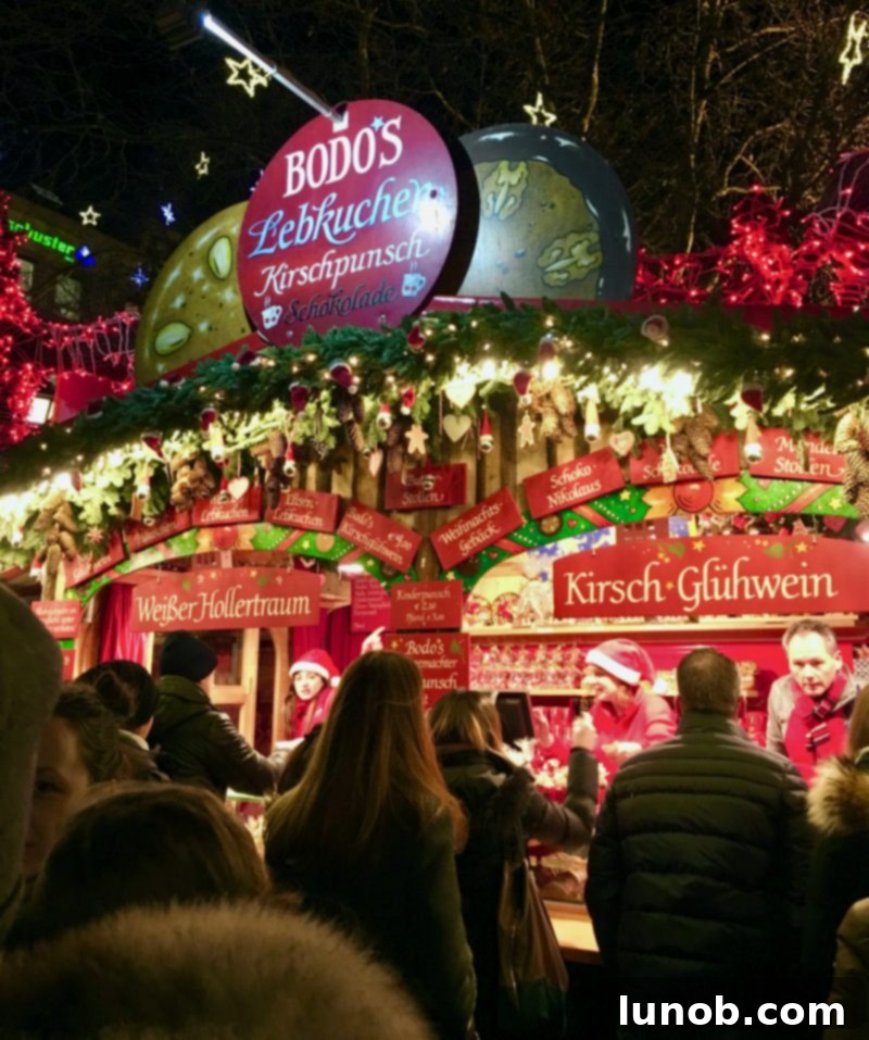 Gluhwein German Mulled Wine Munich Nuremberg Tradition 4 Glühwein stands bustling with visitors at a German Christkindlmarkt